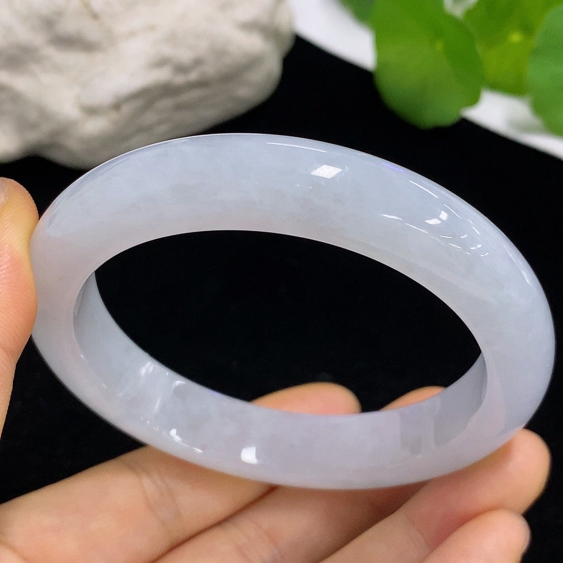 Jadeite round bangle with size 58.8 and weight 64.88g, showcasing smooth, polished jade surface and craftsmanship.