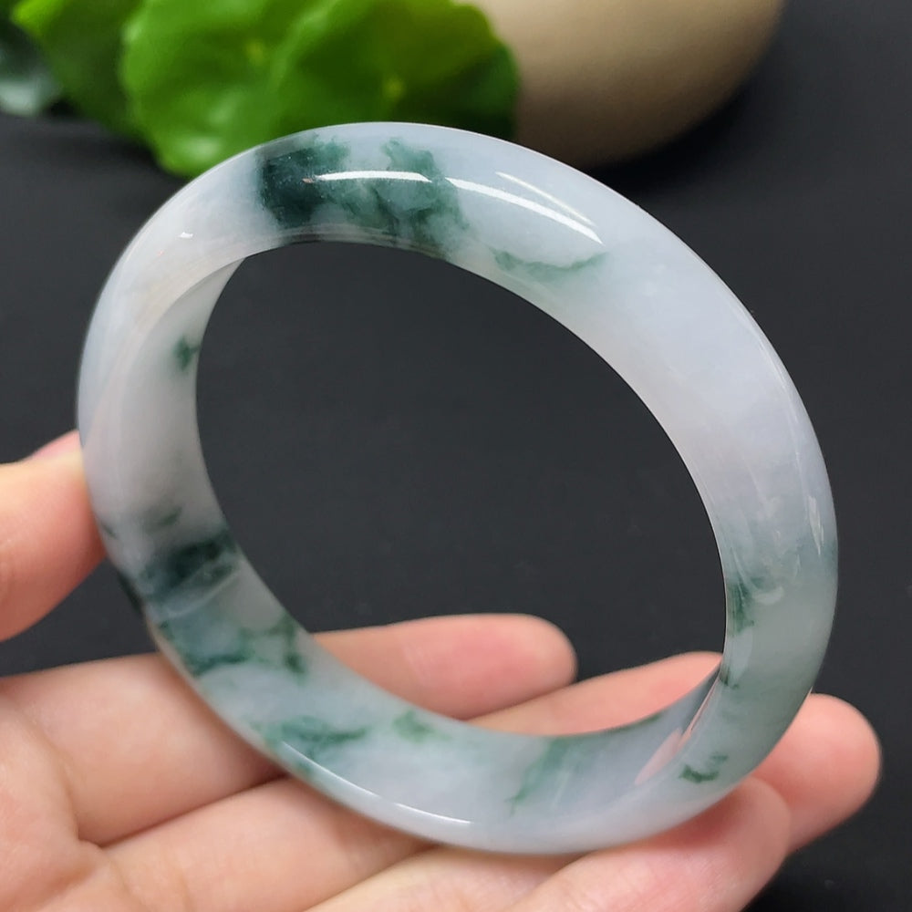 HKHQ jadeite round bangle with mineral components, weighs approx. 54.31g, size 57.9, showcasing smooth, polished surface.