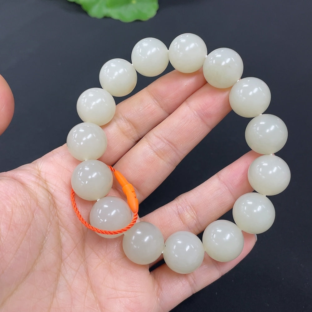 HKHQ Hetian jade bracelet, 13.9mm beads, natural green hues, crafted from high-quality jade, with a smooth polished finish.