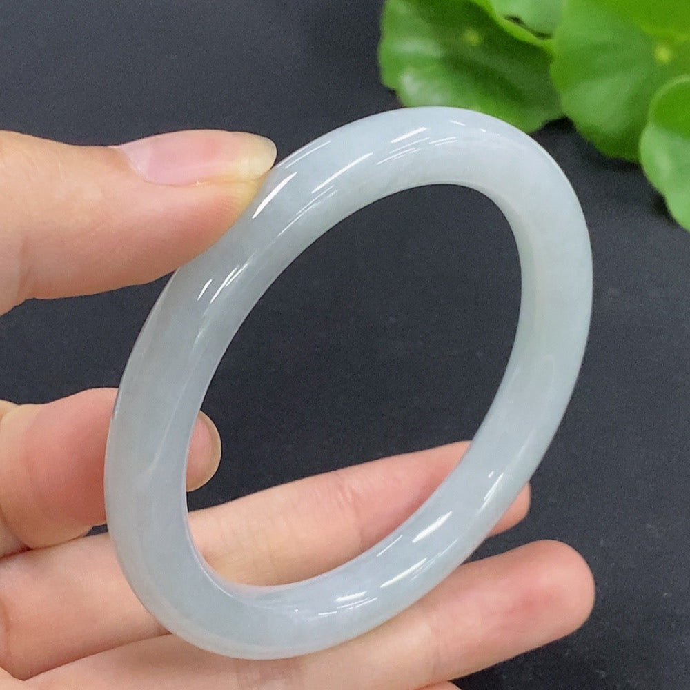 Jadeite round bangle in size 52, weighing approximately 35.12g, featuring smooth, polished jade from HKHQ.