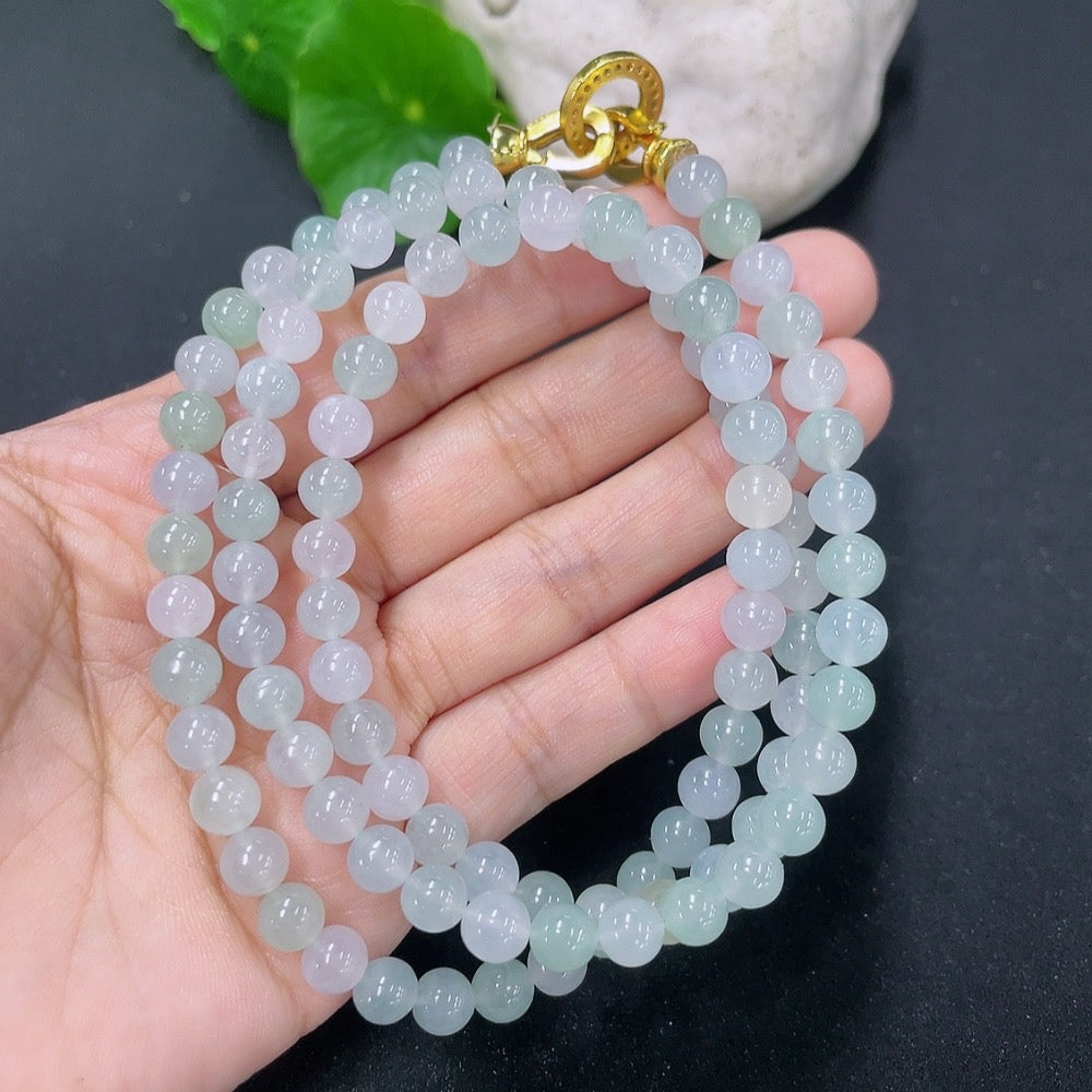 HKHQ jadeite bead necklace with non-gold setting, featuring smooth green beads, weighing 44.94g, close-up view of the jewelry.