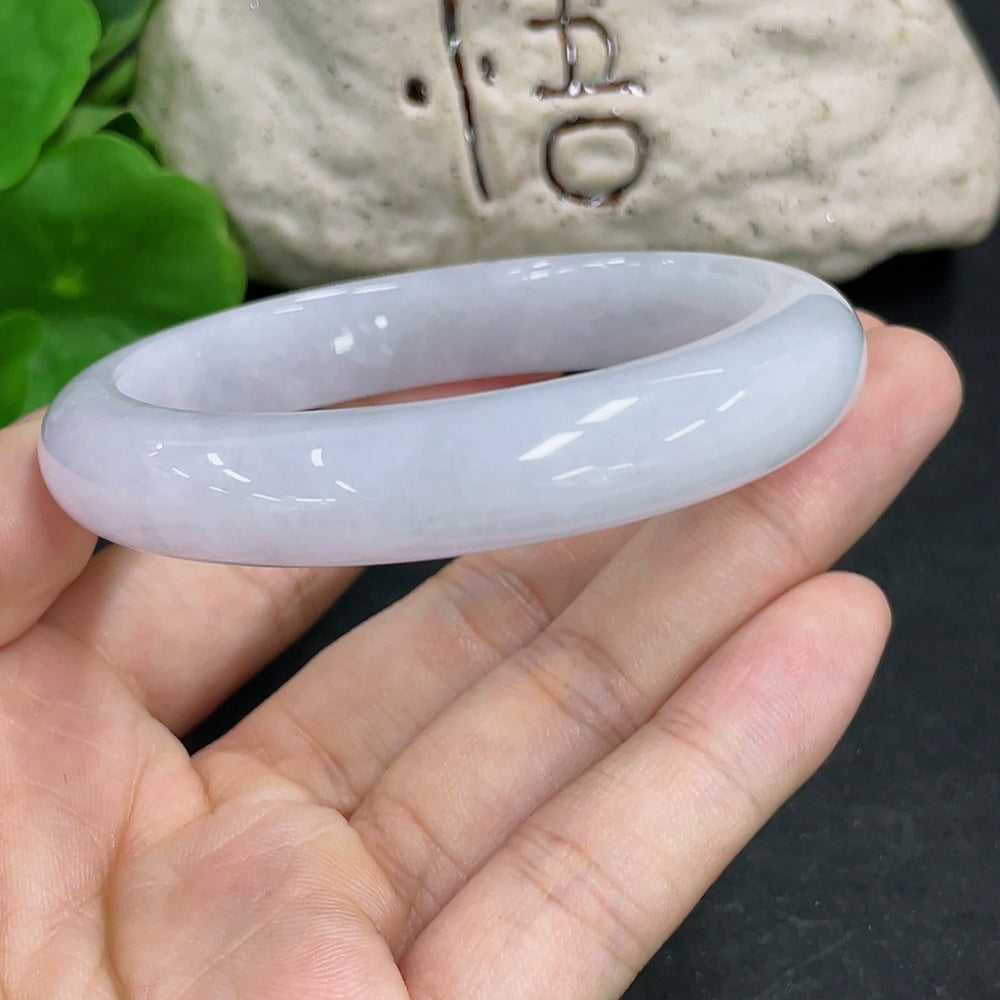HKHQ jadeite round bangle, size 55.8, 52.4g, showing its smooth, polished surface and vibrant green color.