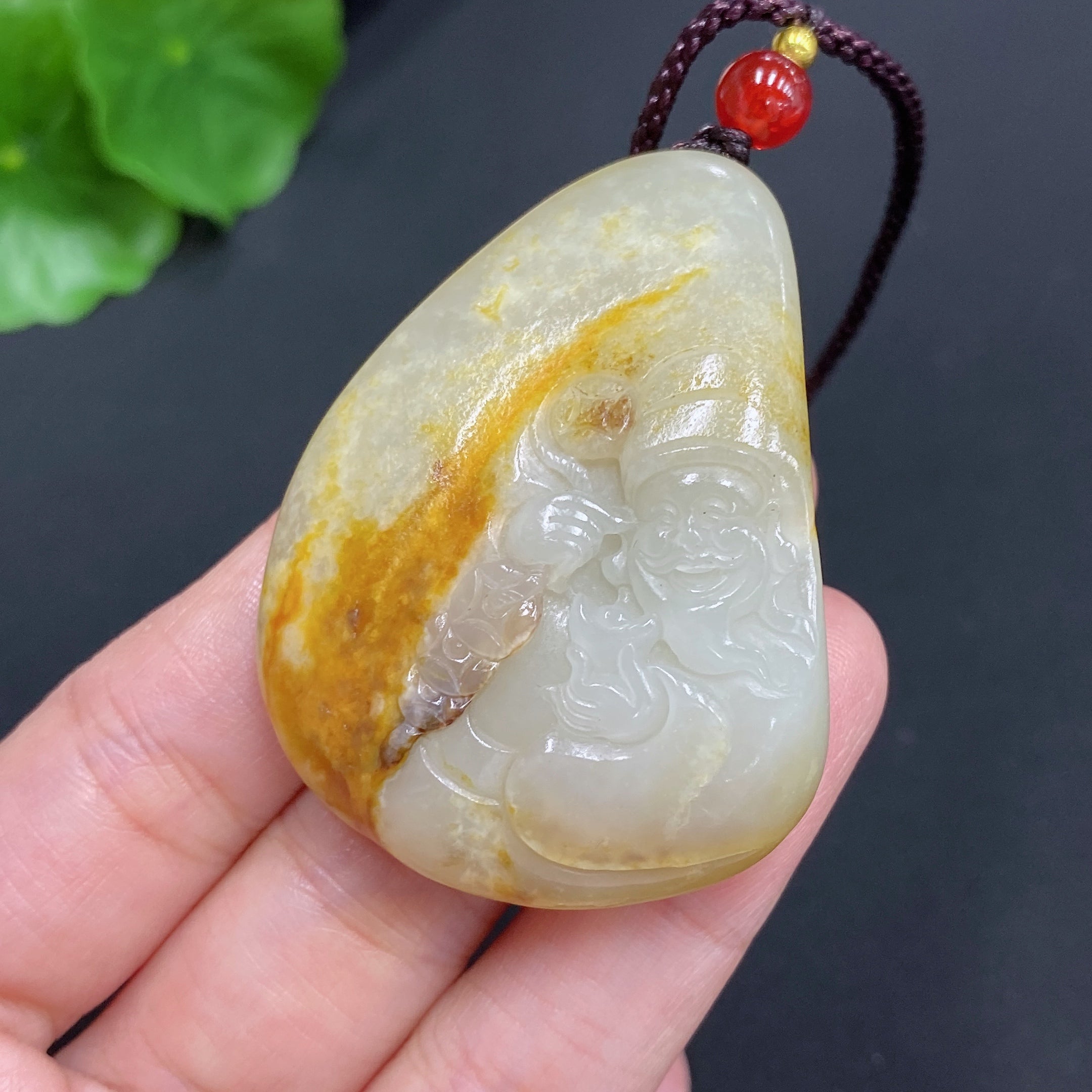 Hetian Jade Pendant    God of Wealth    Total Weight (including rope): 35.1g    Undetermined skin color cause