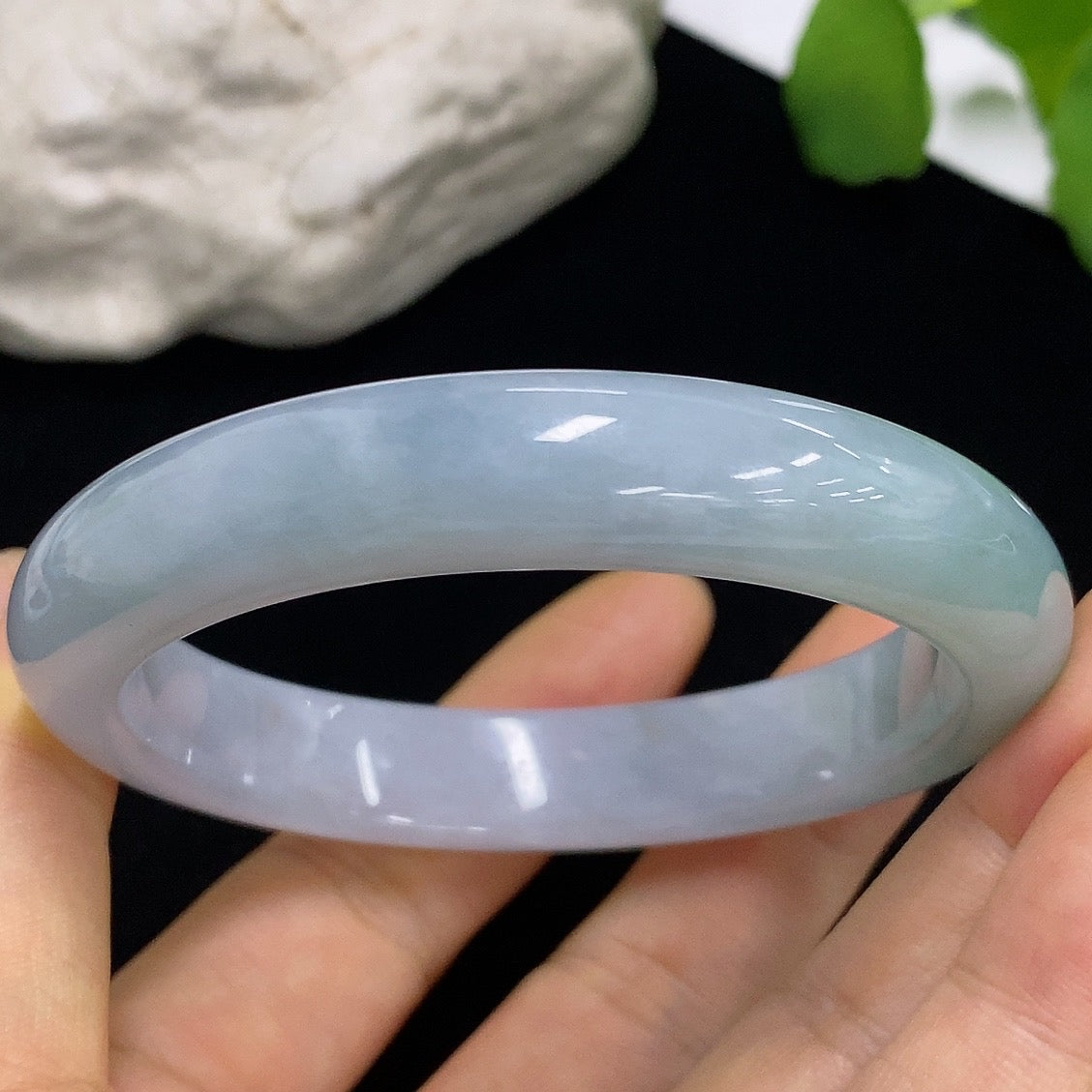Jadeite round bangle in size 57.5 with a total weight of 57.64g, showcasing smooth, polished green jade from HKHQ.
