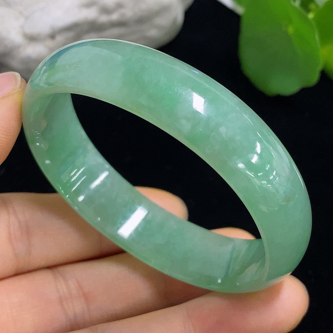 Jadeite Concubine bracelet by HKHQ, size 52.5/47.8, weighs approx. 33.21g, featuring smooth green jade stones.