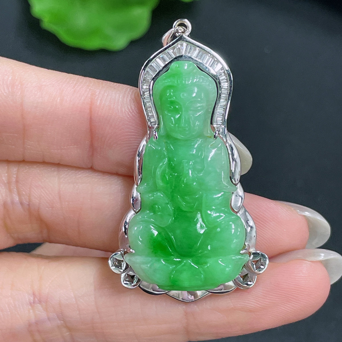 Jadeite Guanyin pendant with 18k gold inlay, crafted from green jade, weighing approximately 9.36g, featuring intricate design.