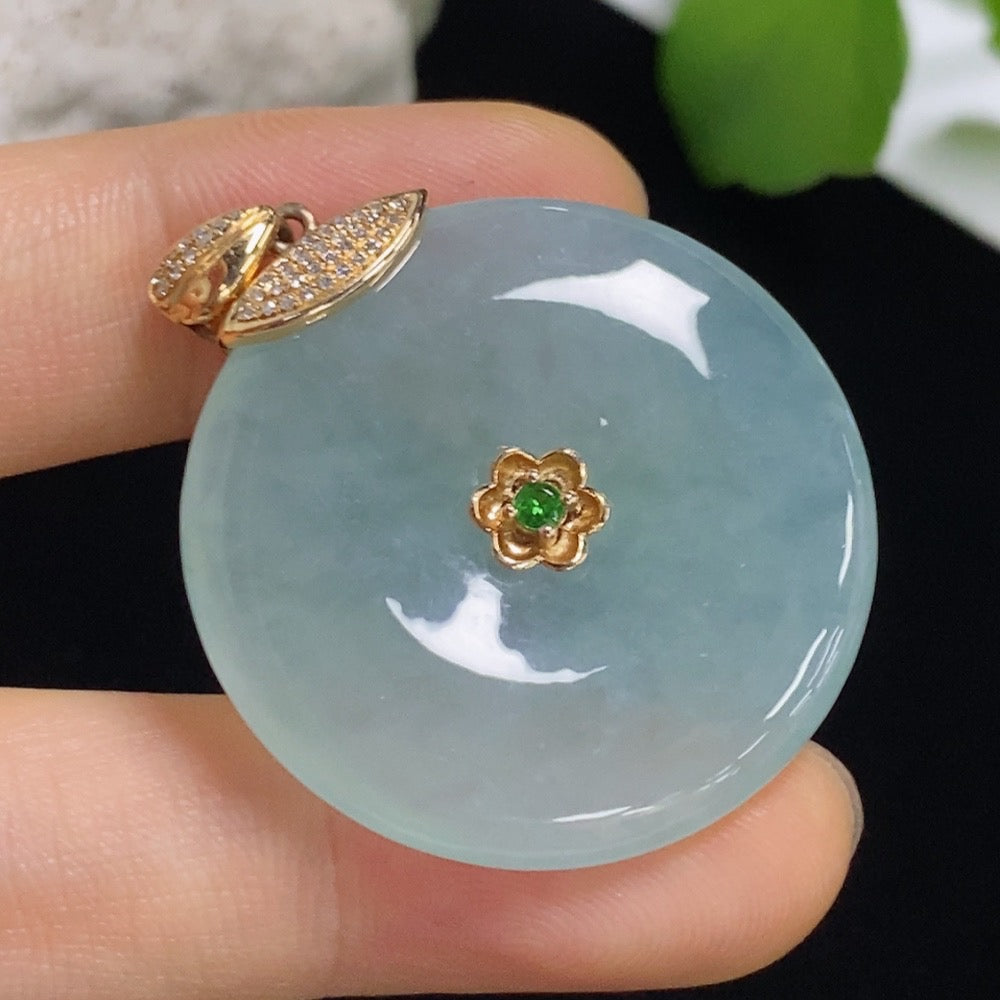 Jadeite safety button pendant with 18K gold and diamond accents, showcasing a smooth, colorless jade piece on a delicate chain.