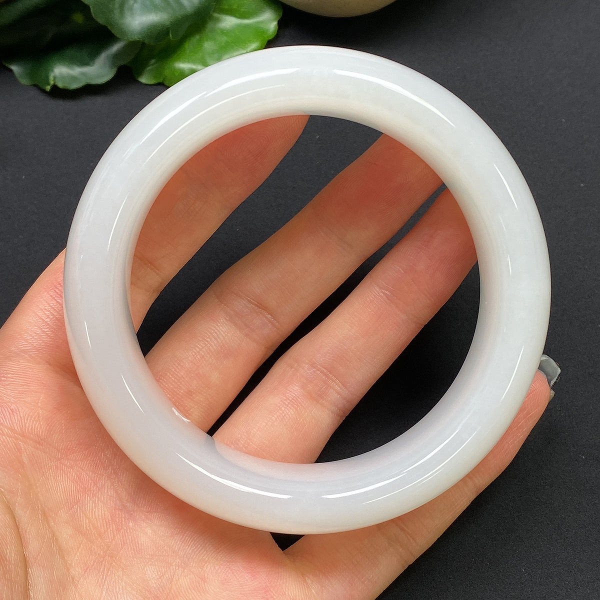 Hetian jade round bracelet with 59.6mm diameter, weighing approximately 112.13g, featuring smooth, polished jade stones.