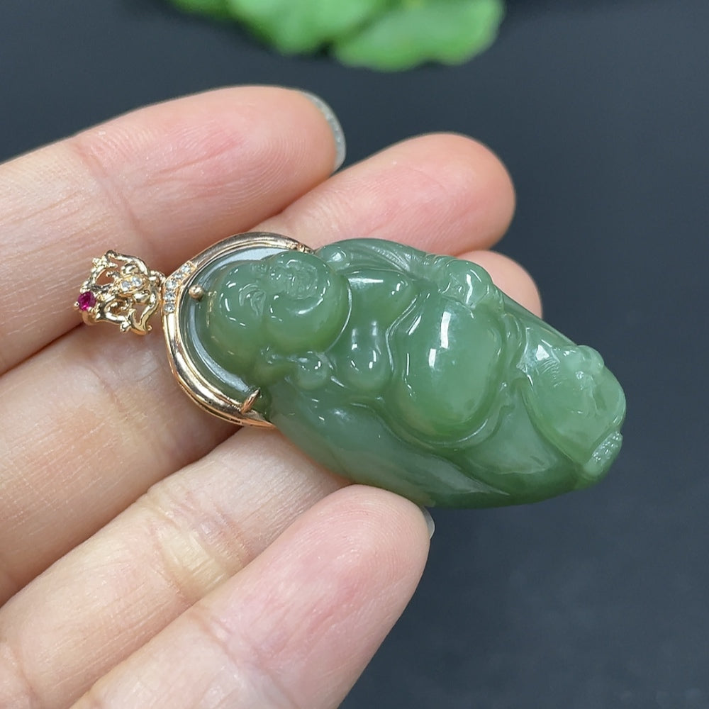 Hetian jade Buddha pendant with 18K gold inlay, accented with diamonds, showcasing intricate craftsmanship and elegant design.