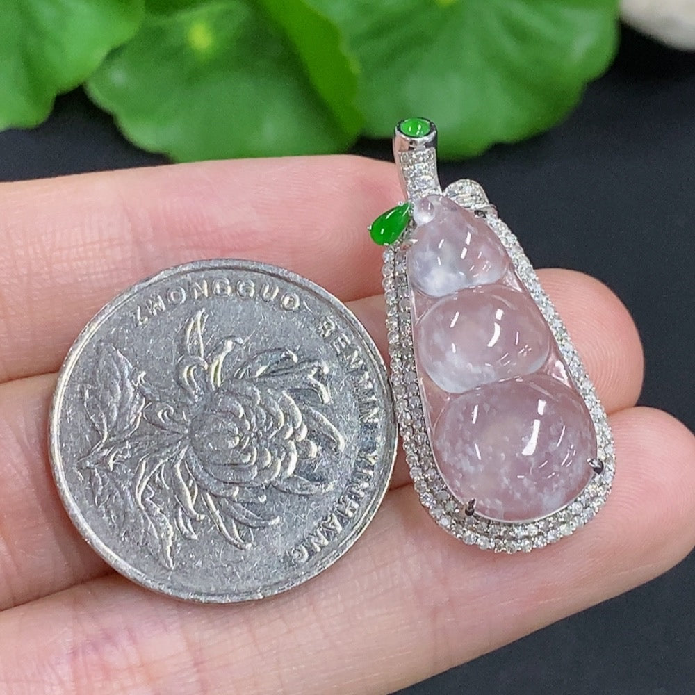 Jadeite lucky bean pendant with 18K gold accents and diamond details, showcasing a smooth, polished jade gemstone.