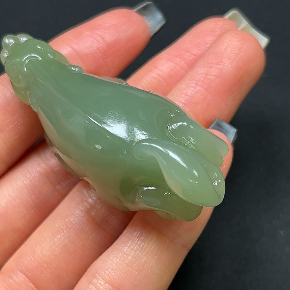 Hetian Jade Pi Xiu pendant by HKHQ, featuring a detailed carved jade figure, weighs approximately 40g, showcasing traditional craftsmanship.