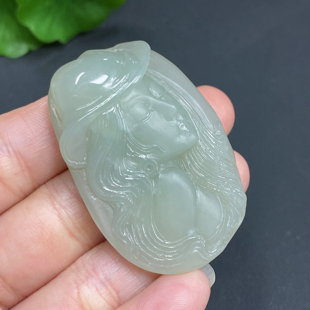Hermes Jade Pendant by HKHQ featuring a detailed design, weighing approximately 21.8g, showcasing natural jade color and craftsmanship.