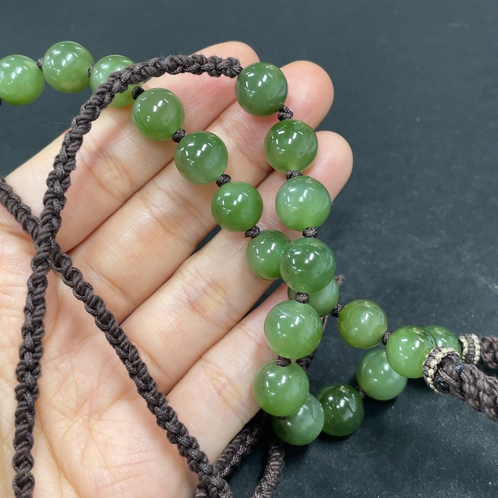 Hetian jade Buddha pendant necklace with rope, weighs 141.1g, featuring a polished jade pendant and traditional design, HKHQ.