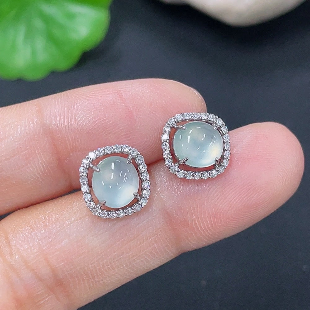 HKHQ jadeite earrings set in 18k gold with diamond accents, showcasing elegant green jade stones and sparkling details.