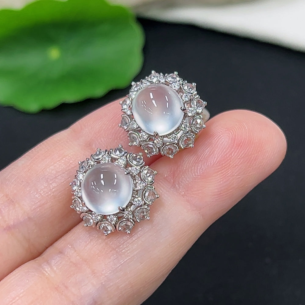 Unmarked 18k gold jadeite earrings with diamond accents, weighing approximately 4.9g, featuring elegant jade jewelry design.