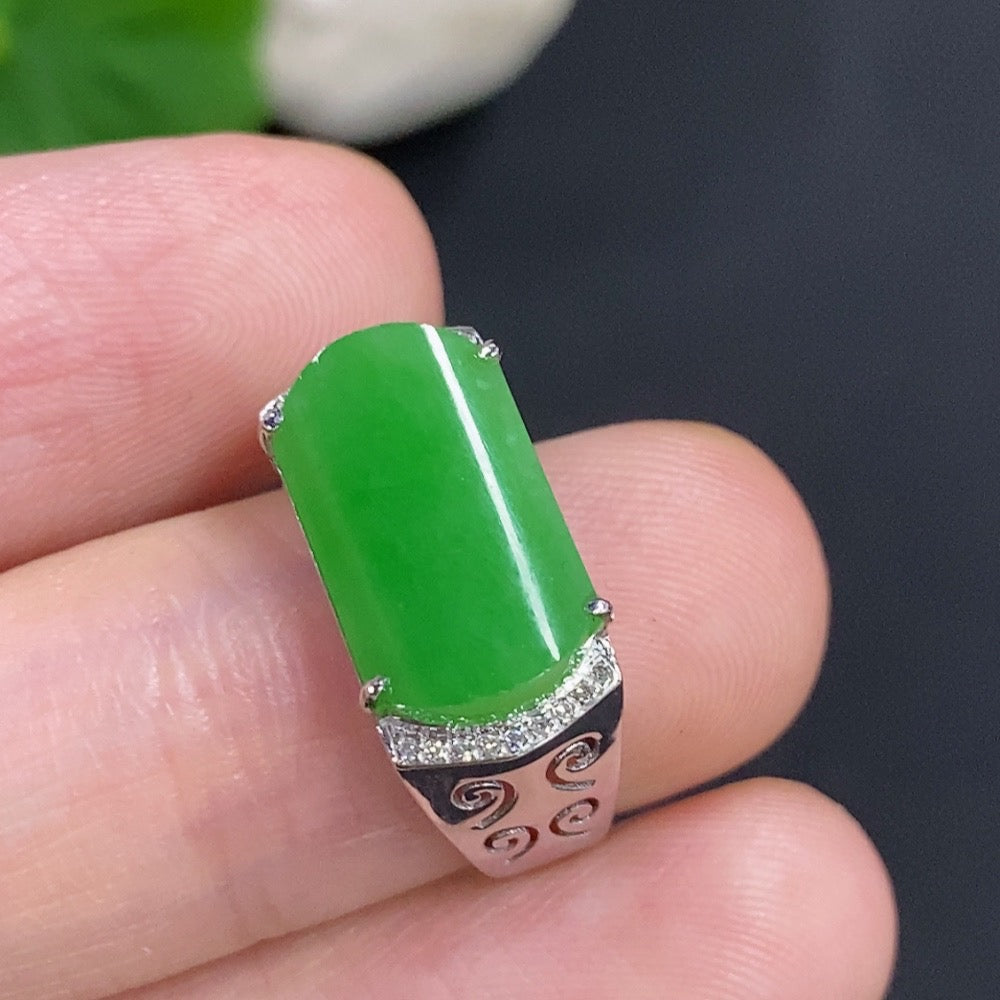 Jadeite cabochon ring with diamond accents in 18k gold, size 13, weighing about 3g, featuring a polished green jade gemstone.