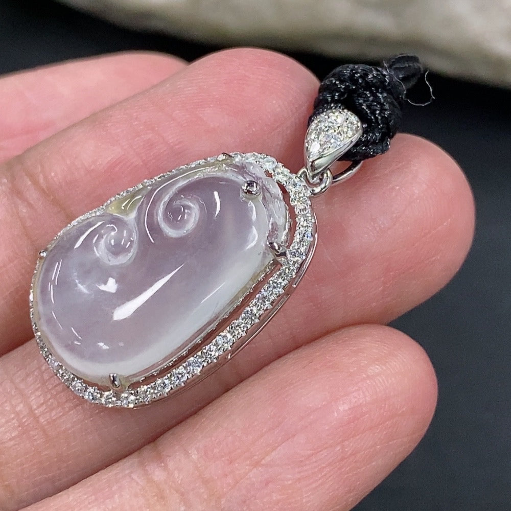 Jadeite Ruyi pendant with 18k gold and diamond accents, featuring intricate inlay work and a rope for jewelry display.