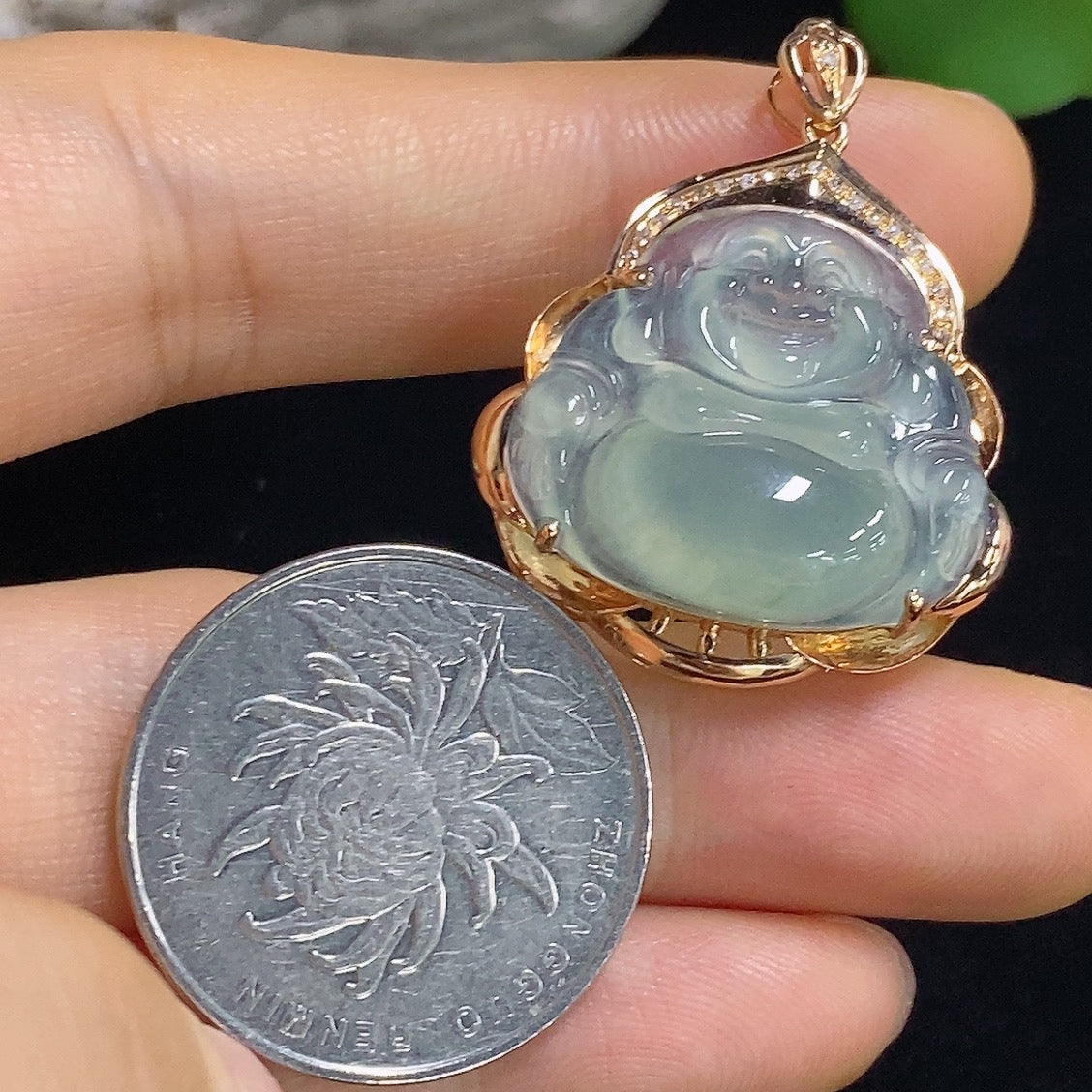 Jadeite Buddha pendant with 18k gold accents and diamond details, weight approx. 5.65g, featuring a carved jade Buddha figure.