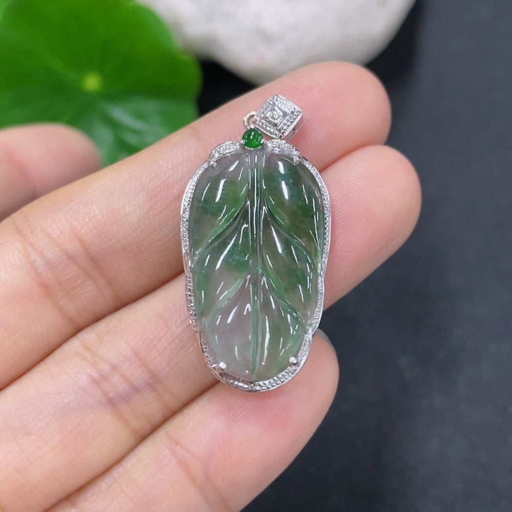 Jadeite leaf pendant with 18K gold and diamond accents, featuring a delicate jade jadeite leaf design, weight approximately 2.33g.