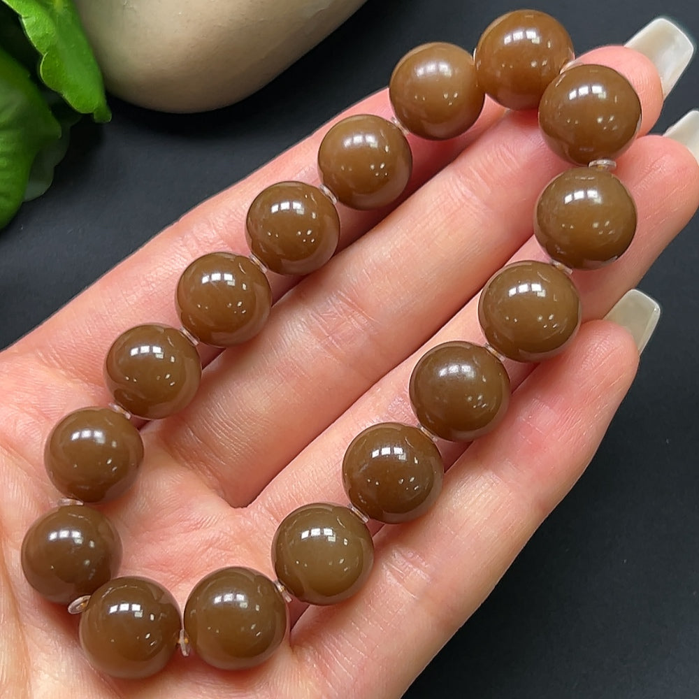 Hetian jade bracelet with 12.1mm beads and 43.69g weight, showcasing smooth polished jade stones from HKHQ.