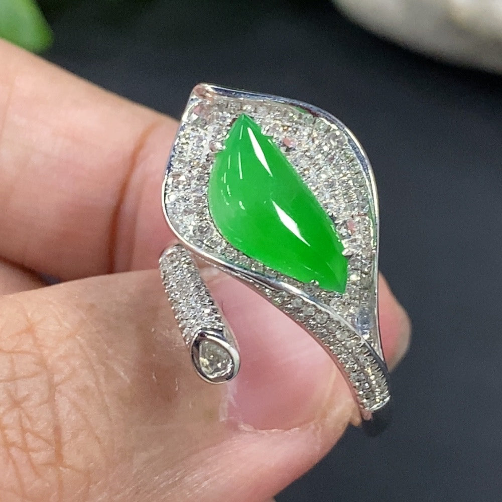 Jadeite freeform inlaid ring with 18K gold band and diamond accent, featuring intricate design and polished finish.