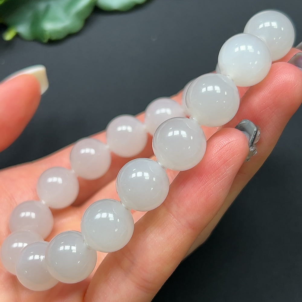 HKHQ Hetian Jade bracelet with 11.9mm beads, 44.52g weight, showcasing smooth, polished jade stones on a delicate bracelet.