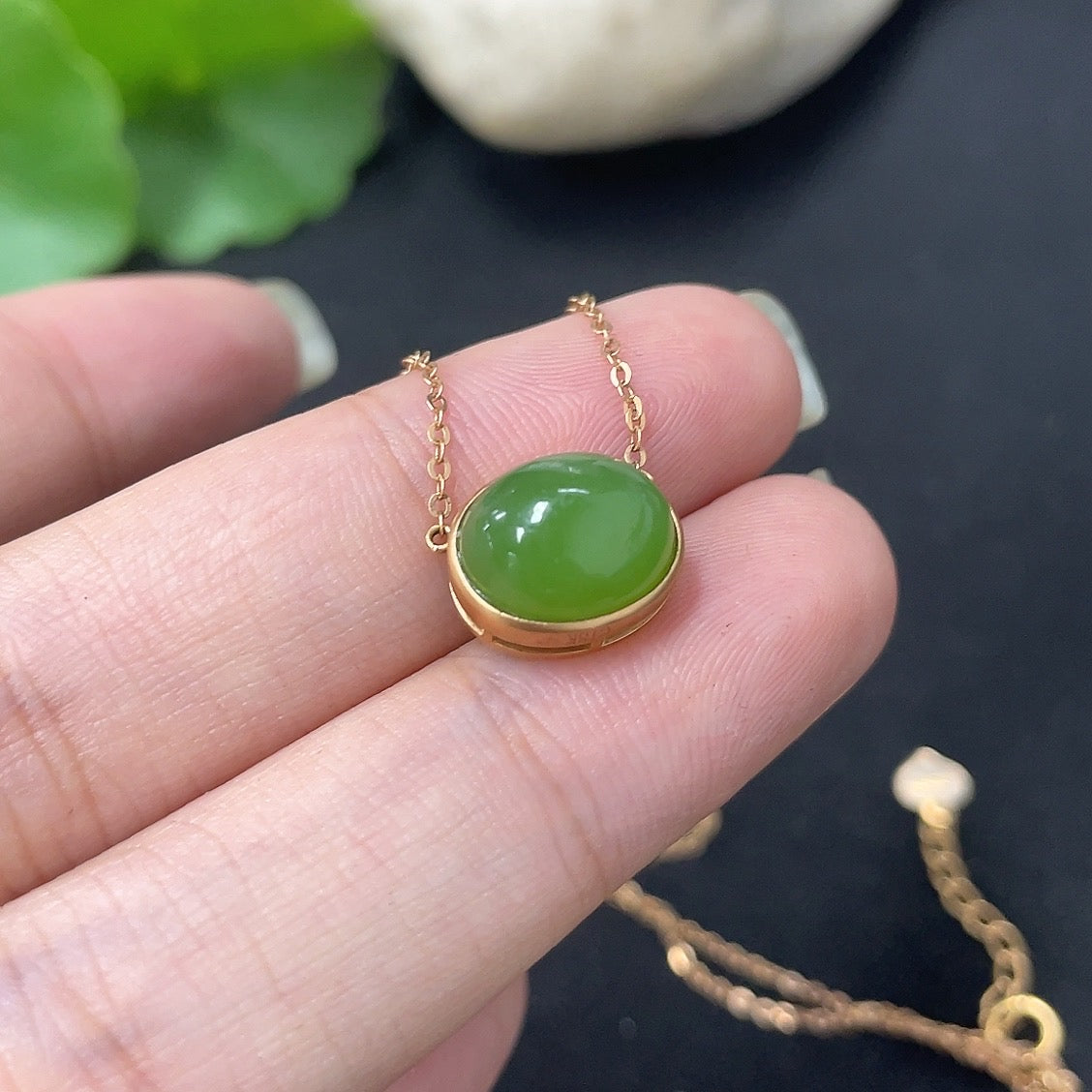 Hetian jade inlaid pendant with 18k gold setting, HKHQ necklace featuring a polished jade piece on a delicate chain