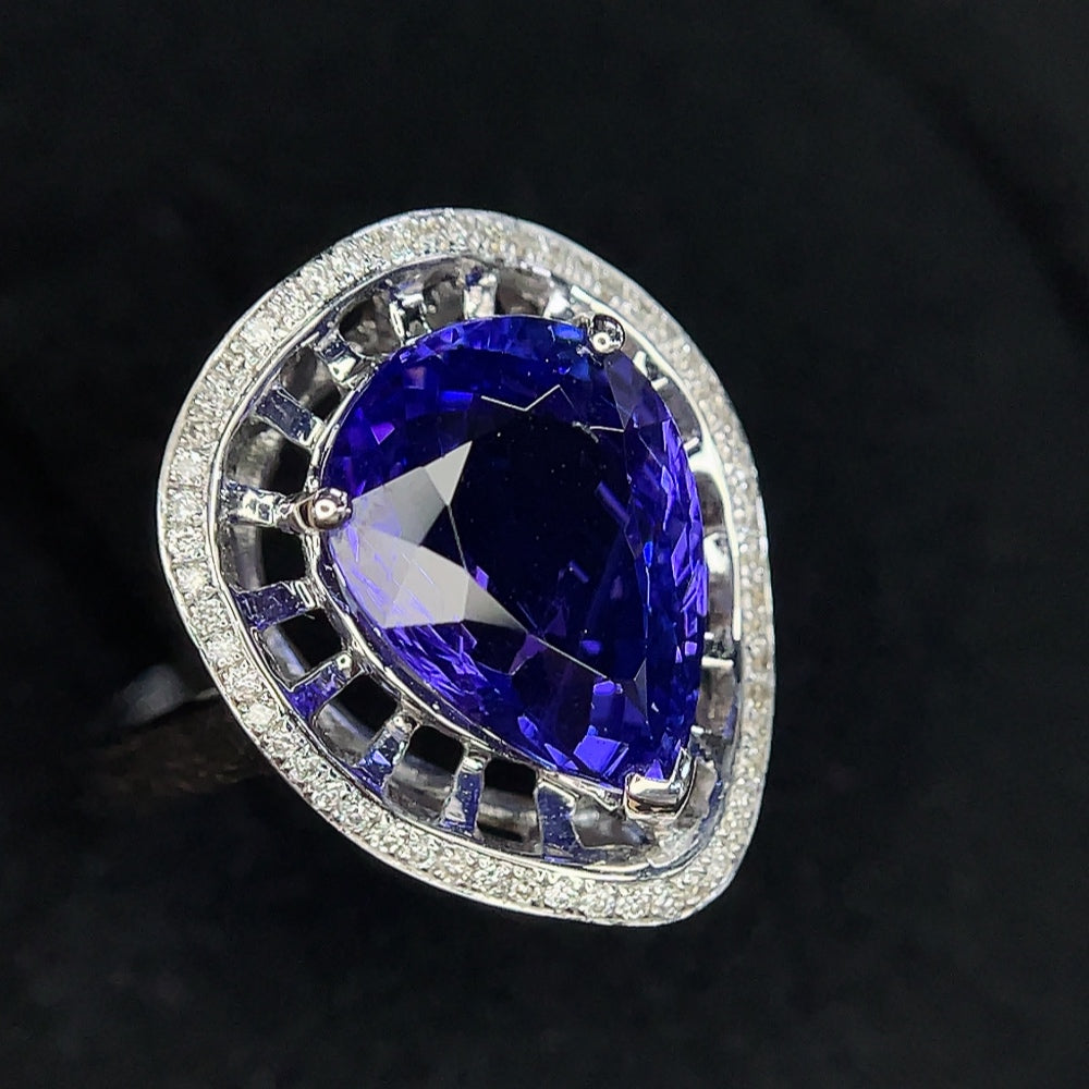 18K gold Tanzanite and diamond accent ring in size 11, featuring vibrant gemstones and elegant design by HKHQ.