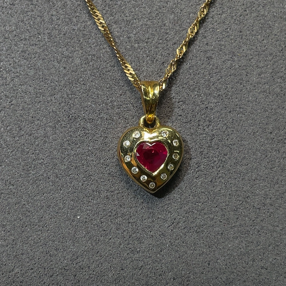 18K gold ruby pendant with diamond accents, total weight including chain approximately 4.14g