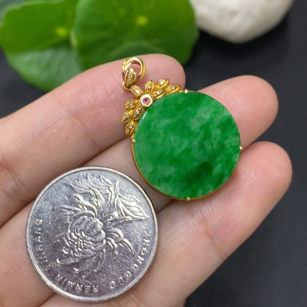 Jadeite plain pendant with 18K gold mount and diamond accents, shown on a necklace chain, with mineral components visible.