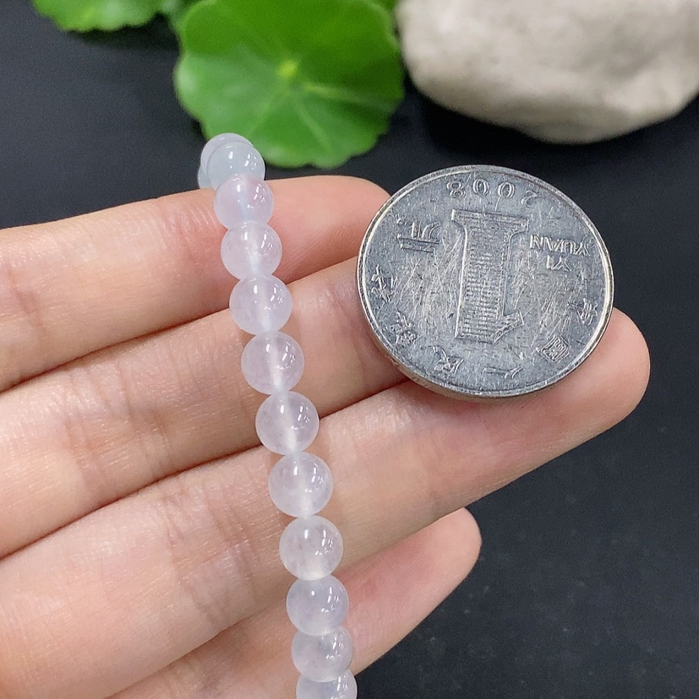 HKHQ jadeite bracelet with 5.9mm beads, approximately 10.8g, showcasing smooth, polished jade stones on a delicate jewelry strand.