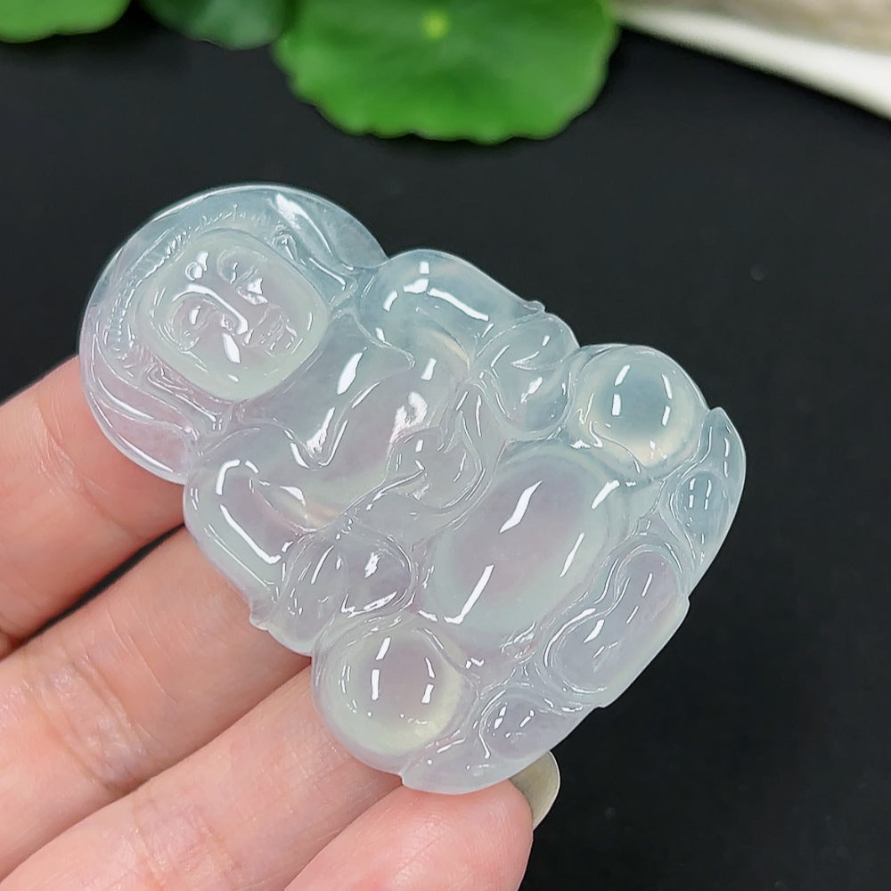 Jadeite Guanyin pendant featuring intricate carving, weighing approximately 21.1g, crafted by HKHQ in smooth jade material.