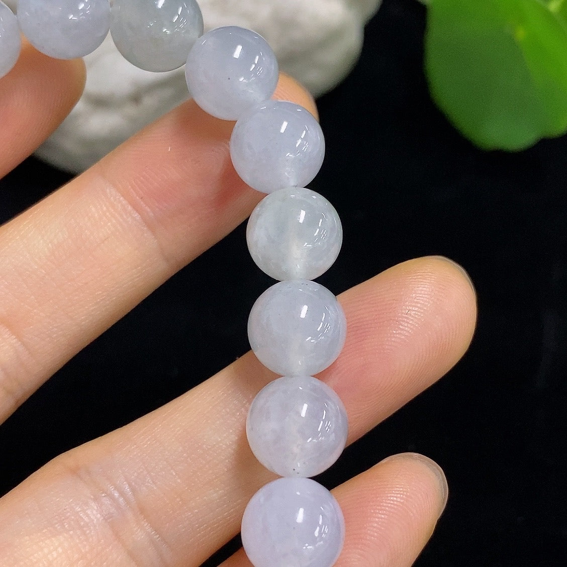 HKHQ jadeite bracelet with 9.6mm beads, approximately 31.93g, showcasing smooth, polished jadeite stones on a flexible bracelet.