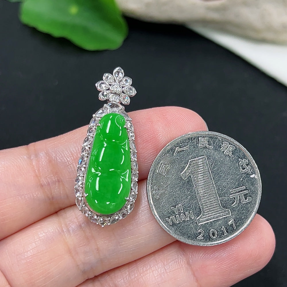 Jadeite auspicious bean pendant in 18K gold with diamond accents, featuring a smooth green jade stone and intricate gold detailing.
