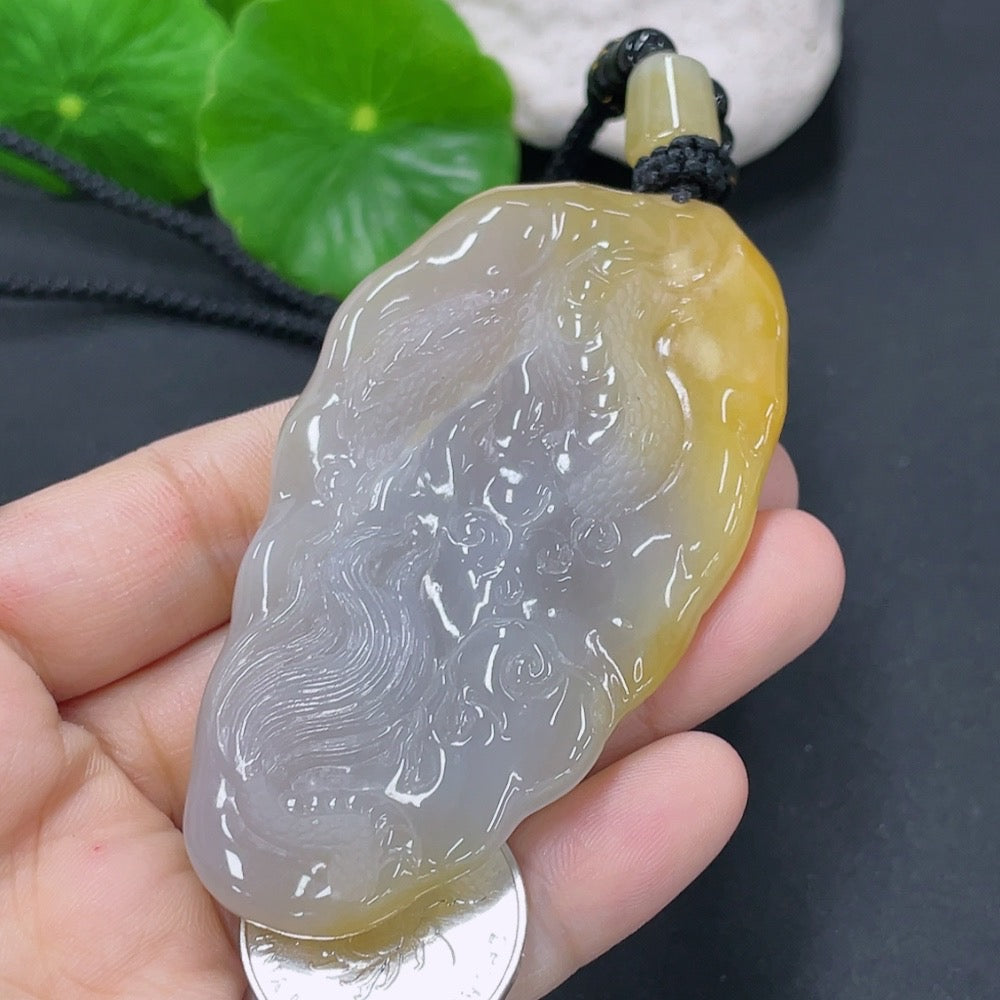 Jadeite dragon pendant with a total weight of approximately 70.5g including the cord (matching beads are non-A)