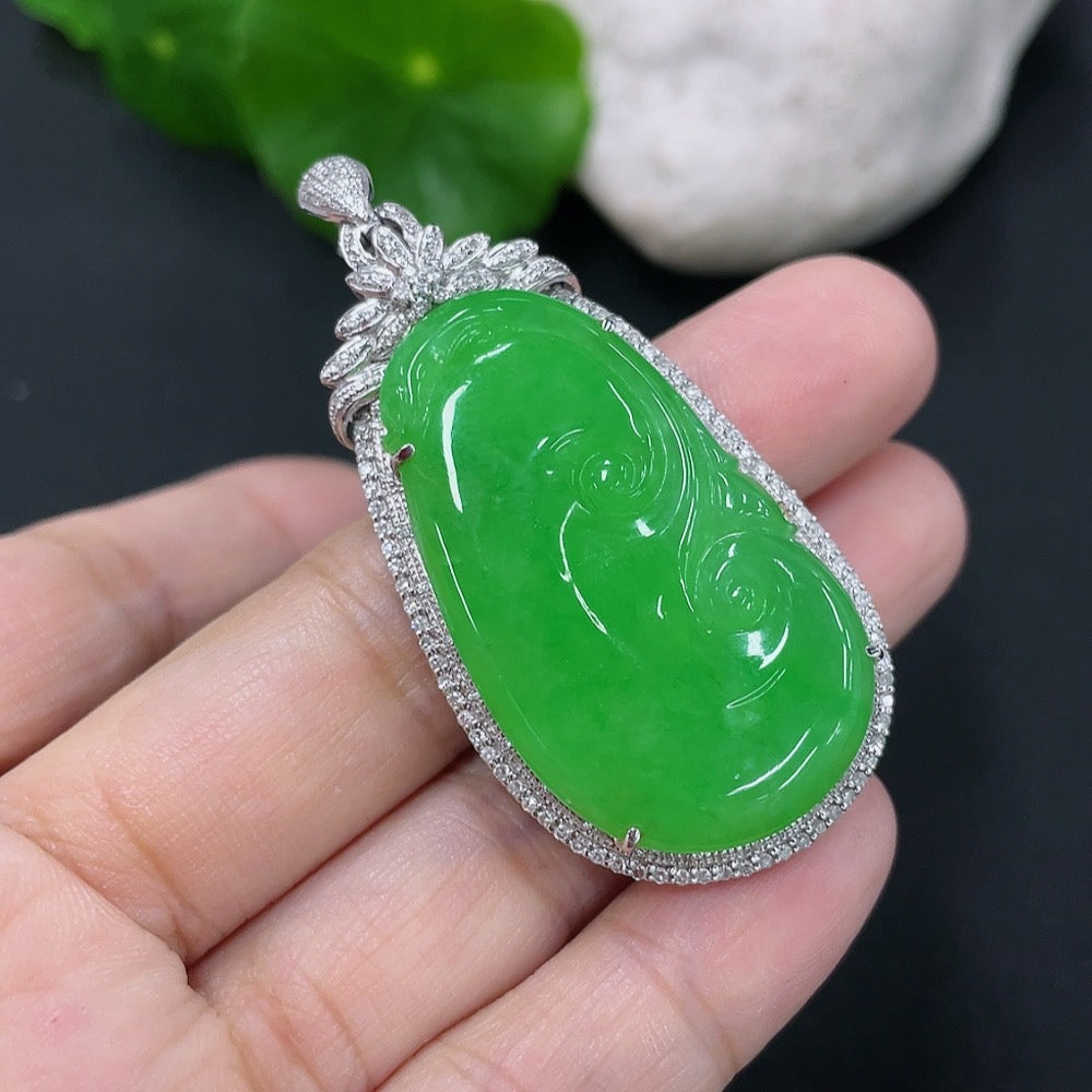 Jadeite inlaid Ruyi pendant with 18K gold and diamonds, showcasing intricate craftsmanship and elegant design.