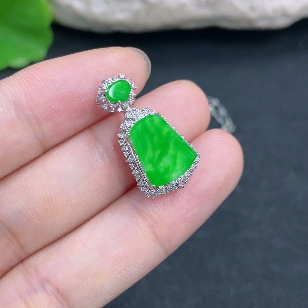 Jadeite pendant with 18K gold and diamond accents, showcasing a smooth jade stone, on a delicate chain from HKHQ.