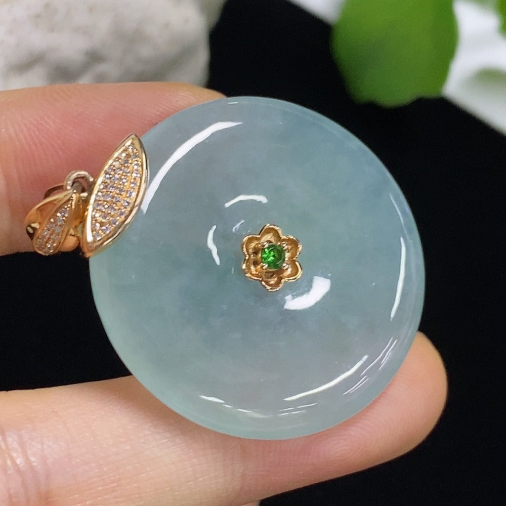 Jadeite safety button pendant with 18K gold and diamond accents, showcasing a colorless jade gemstone on a delicate chain.