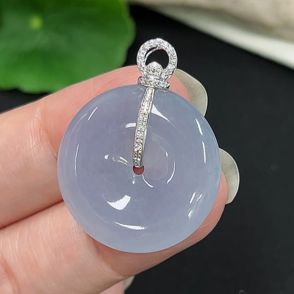 Jadeite peace knot pendant by HKHQ with 18K diamond accents, showcasing a smooth jade pendant with intricate knot design.