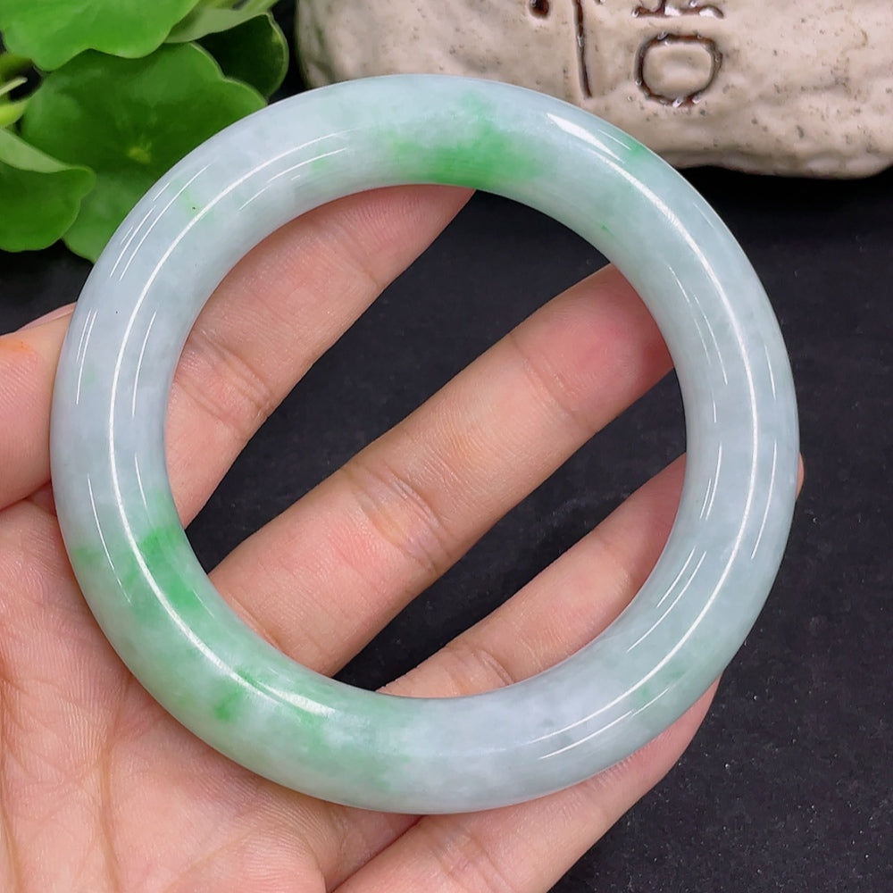 Jadeite round bangle with a total weight of 80.5g and size 56.2, showcasing smooth jadeite surface and rich green color.