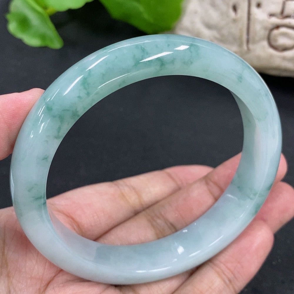 Jadeite round bangle with a 59.2mm diameter, weighing approximately 57.62g, featuring smooth, polished jadeite surface.