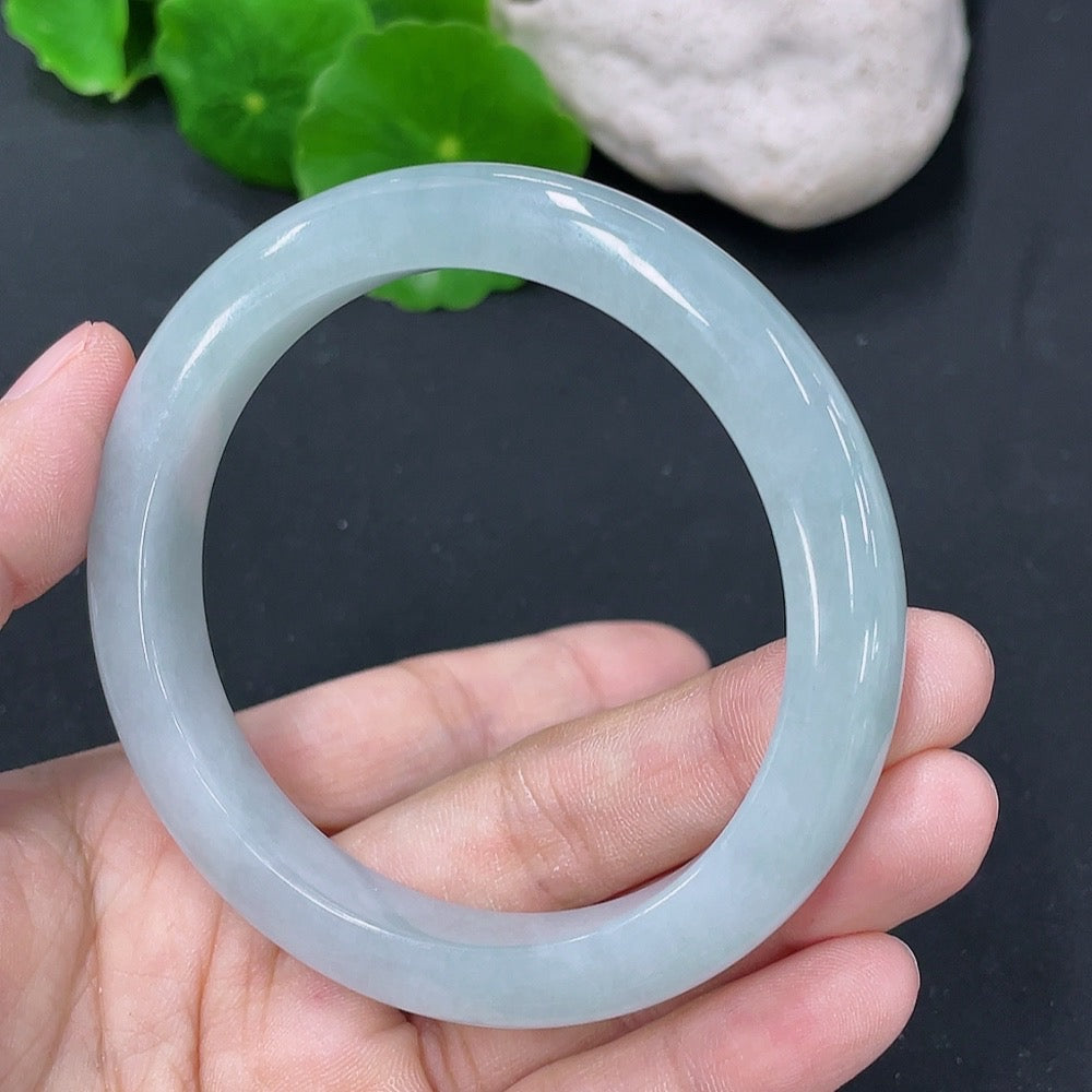 Jadeite round bangle with a 55.2mm diameter, weighing approximately 44.76g, crafted by HKHQ, showcasing smooth, polished jade surface.