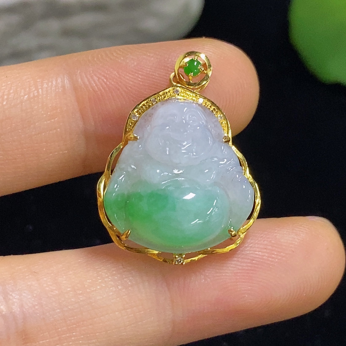 Jadeite Buddha pendant with diamond accents in 18K gold, weighing approximately 3.3g, featuring intricate craftsmanship and detailed design.