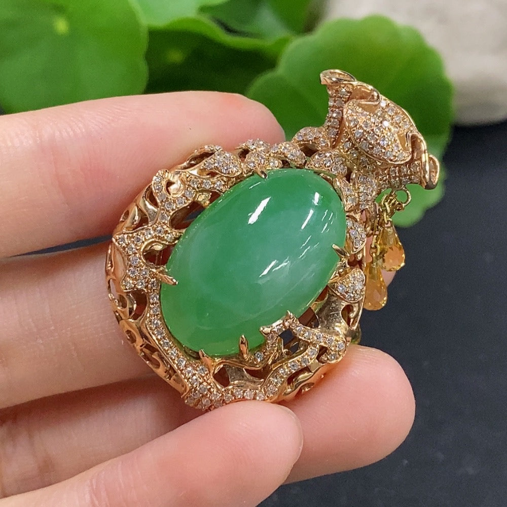 Jadeite pendant with 18K gold setting and diamond accents, elegant necklace featuring a polished jadeite gemstone.