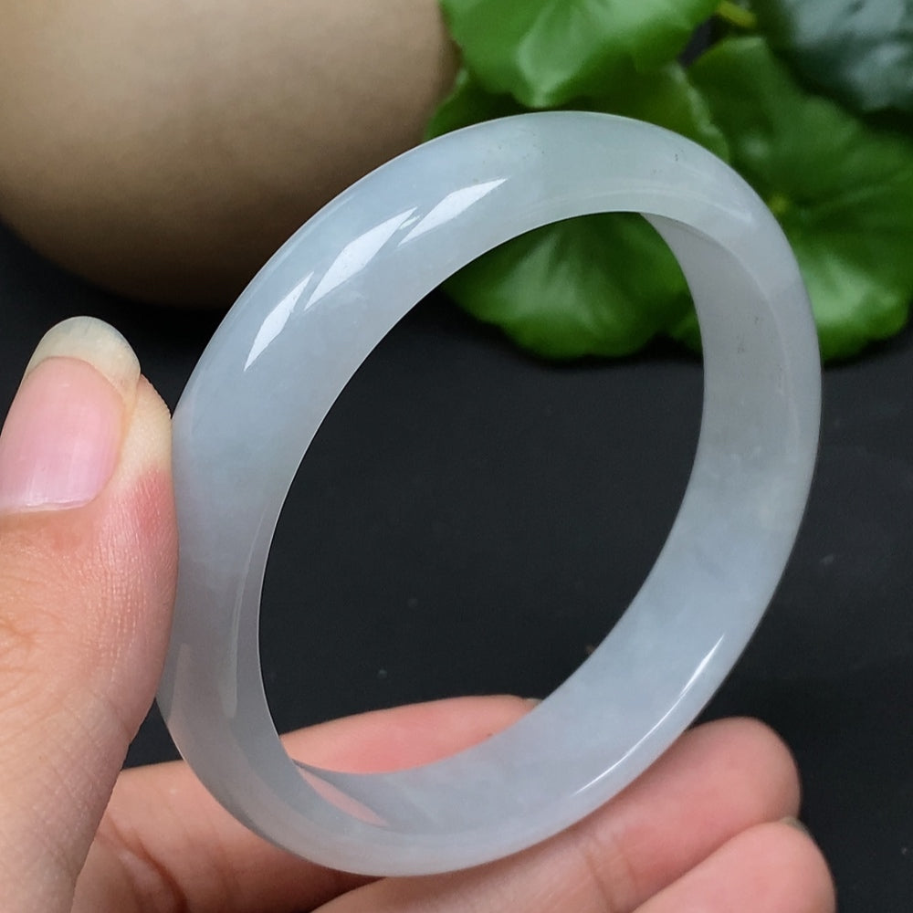 Jadeite round bangle in size 56.5 with a total weight of 43.17g, crafted by HKHQ, featuring smooth, polished jade surface.