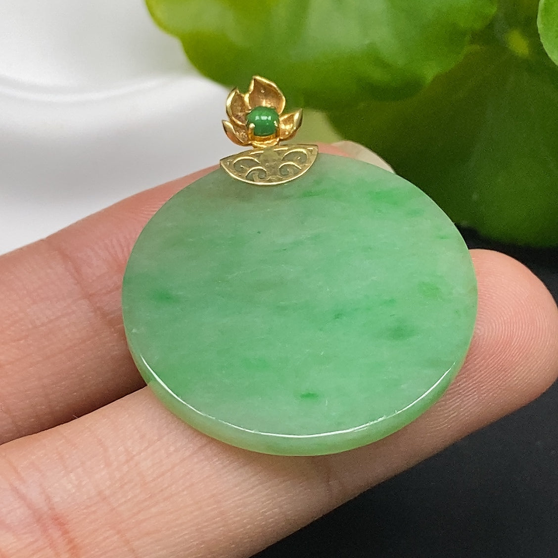 Jadeite plain pendant with 18k gold setting, showcasing a smooth green jade stone, weighing approximately 5.51g.