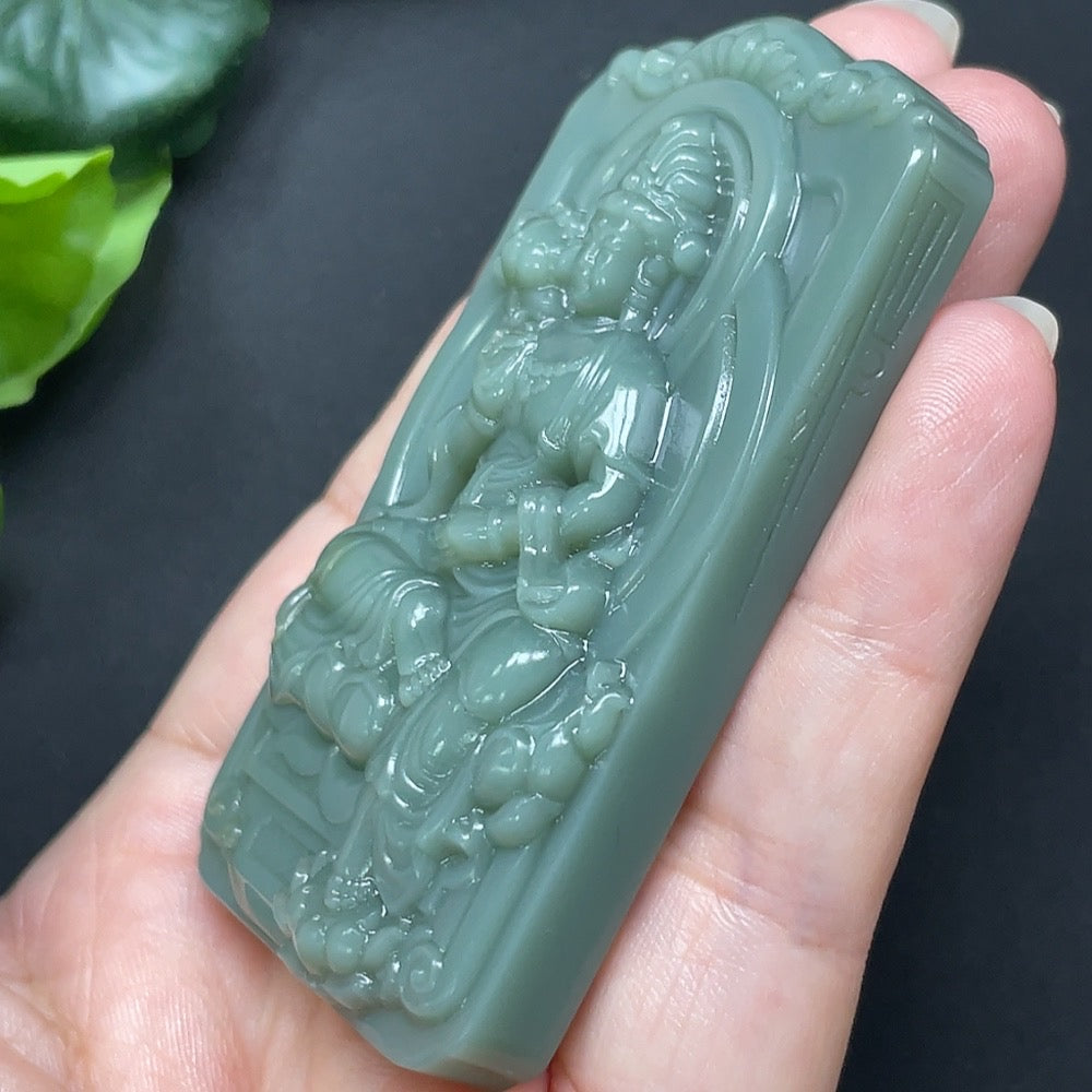 Hetian Jade Jasper Guanyin pendant from HKHQ featuring a detailed carved figure, weighs approximately 79.6 grams.