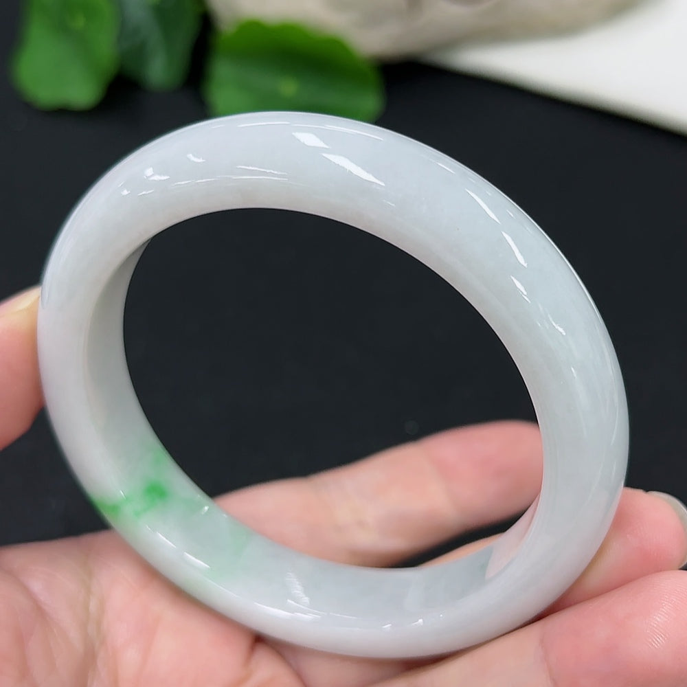 HKHQ jadeite round bangle in size 57.4 with a smooth polished surface, weighing 60.67g, showcasing elegant craftsmanship.