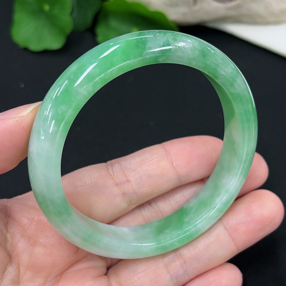 Jadeite round bangle with size 55.1, weighing approximately 50.4g, showcasing smooth, polished green jadeite from HKHQ.