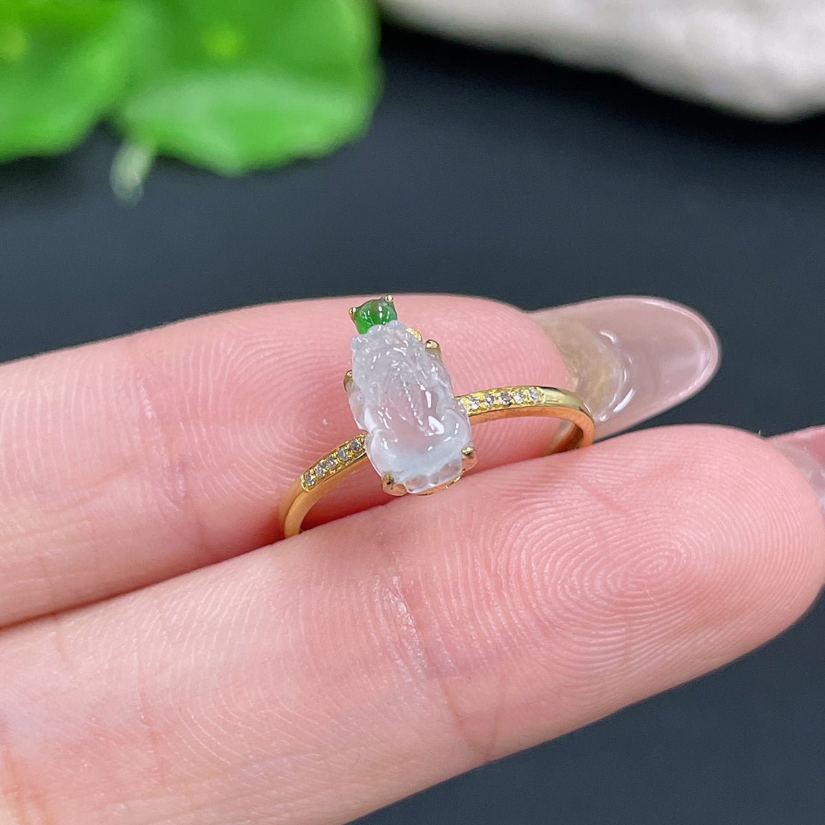 Jadeite ring with 18K gold inlay and diamond accents, showcasing a luxurious jade gemstone in a detailed jewelry setting